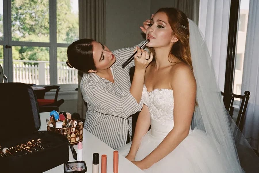 A makeup artist working at a bridal morning